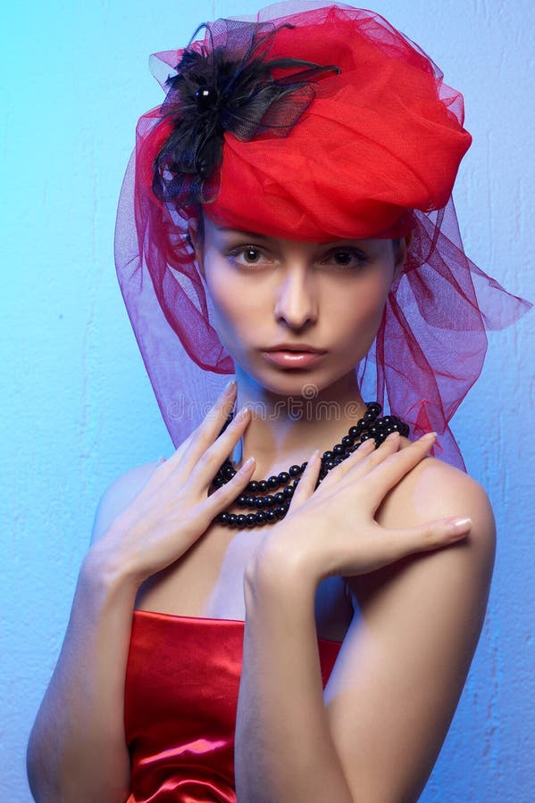 Young beautiful woman in red hat