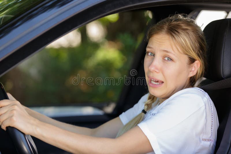 Young beautiful woman scared and stressed while driving car royalty free stock images Young beautiful woman scared and stressed while driving car royalty free stock images
