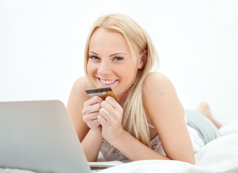 Young beautiful woman shopping using laptop