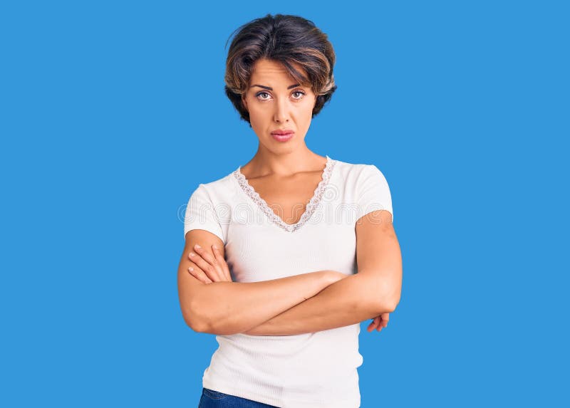 Young beautiful woman wearing casual clothes skeptic and nervous, disapproving expression on face with crossed arms