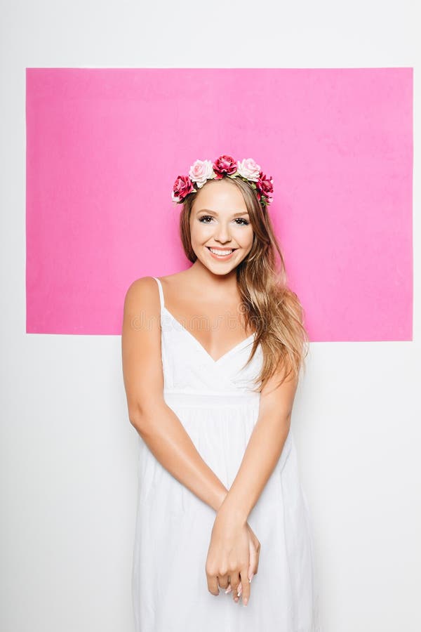 Woman in White Cotton Dress with Flowers in Hair Smiling Stock Photo ...