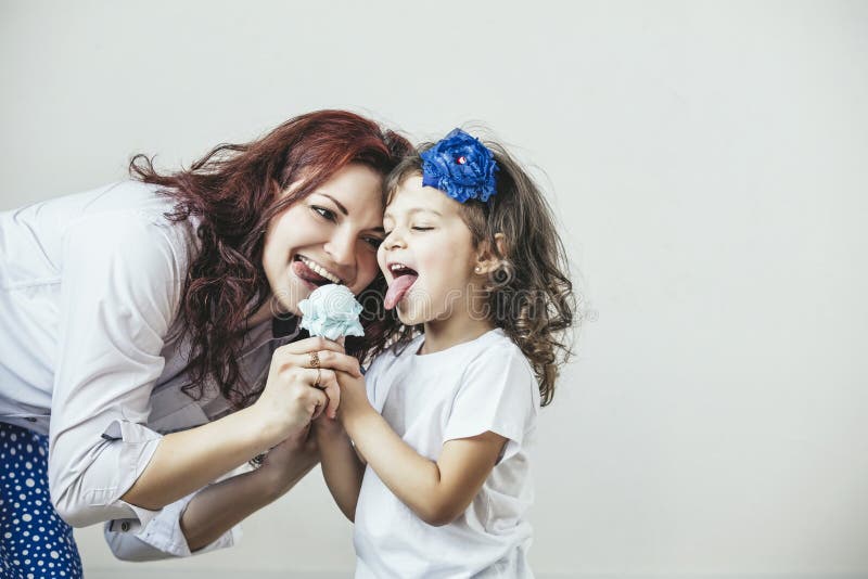 Young beautiful woman mother and daughter with toy a sweet happy royalty free stock image Young beautiful woman mother and daughter with toy a sweet happy royalty free stock image