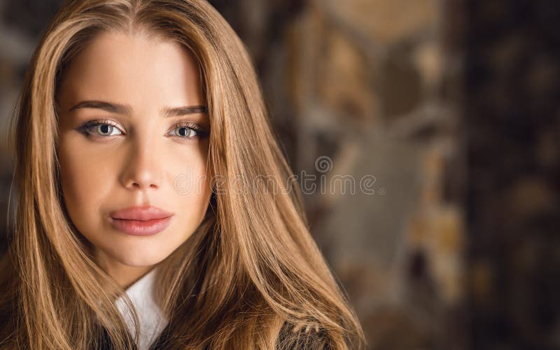 Young beauty woman against house interior.