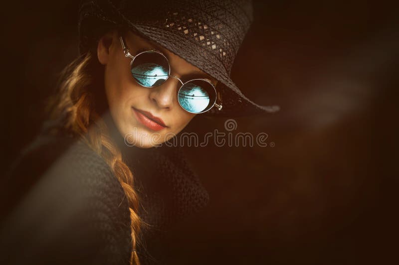 Young beauty woman in steampunk round glasses