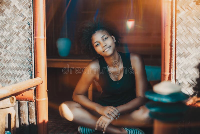 Young black girl sitting on veranda of small hovel royalty free stock images Young black girl sitting on veranda of small hovel royalty free stock images
