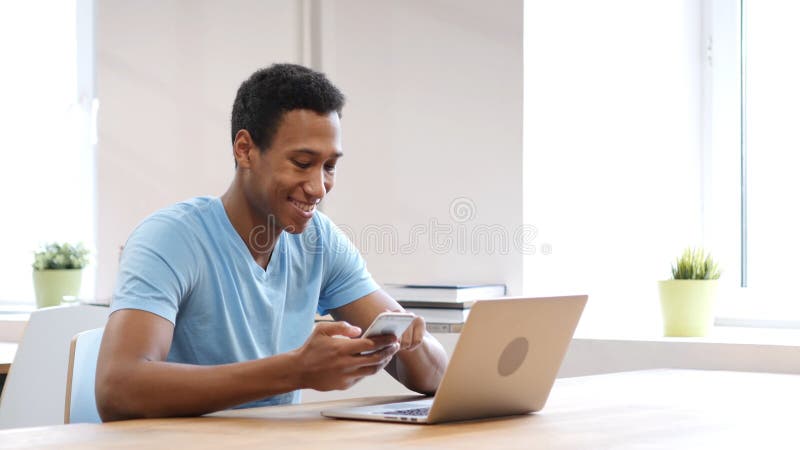 Young Black Man Using Smartphone, Online Browsing