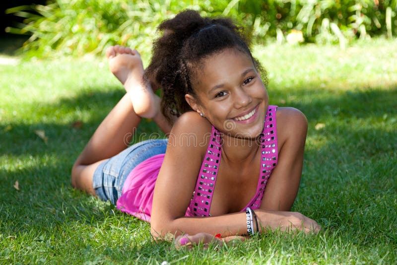 Ebony Teens com Young Black Teenage Girl Lying on the Grass Stock Image - Image of brazilian, human: 21573139