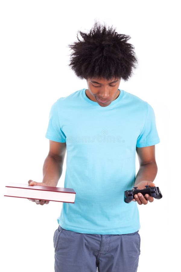 Young black teenage men holding a book and a video game controller - African people