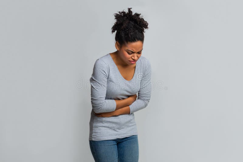 Young black woman having menstrual abdominal pain