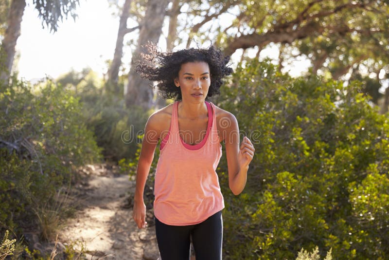 Young Black Woman Jogging in a Forest, Close Up Stock Image - Image of ...