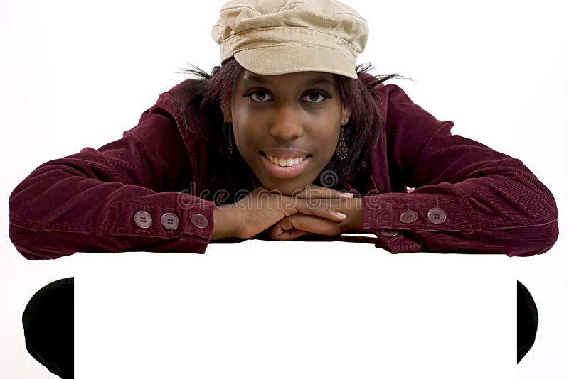 Young black woman leaning over a blank sign for Copy Space