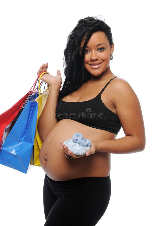 Young Black Woman pregnant with shopping bags