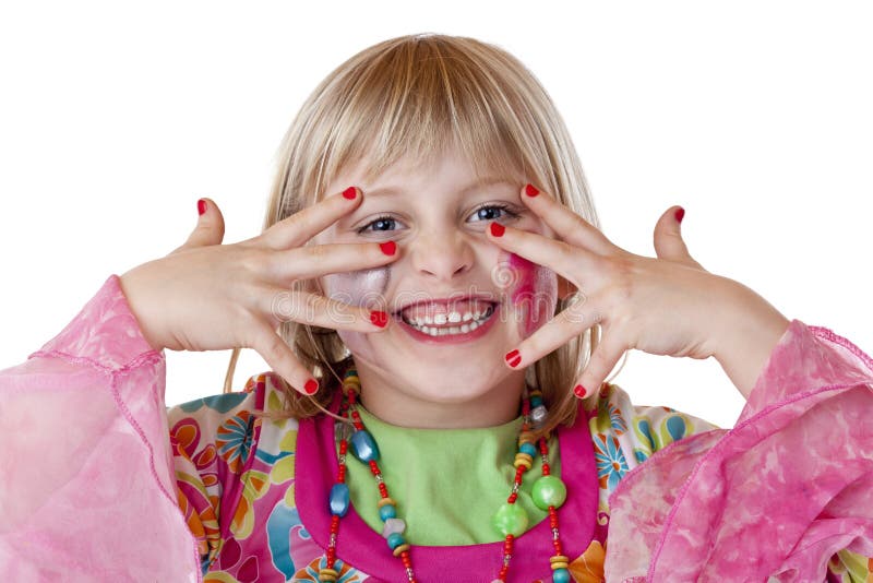 Young blond girl shows red fingernails and laughs