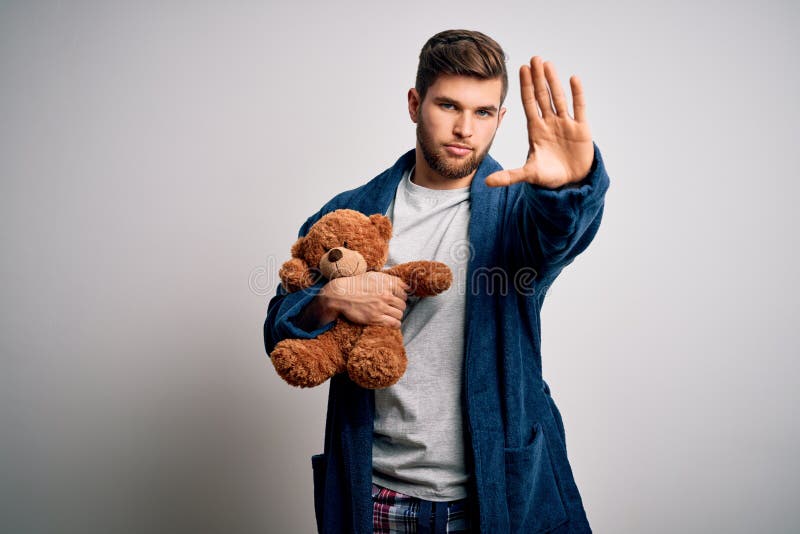 Teddy Bear Holding A Purple Sign That Says Get Well Soon Stock