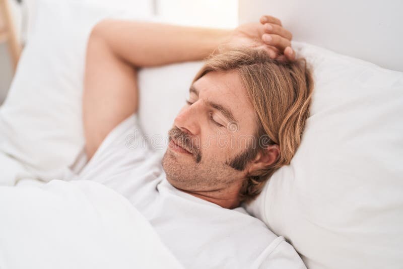 Young Blond Man Lying on Bed Sleeping at Bedroom Stock Photo Image of person, looking 257336656