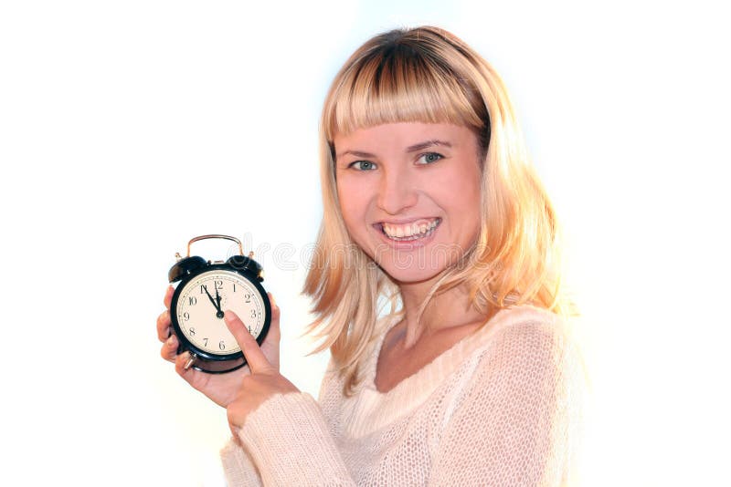 Young blond woman with clock