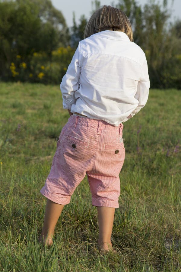 Boys and girls peeing outdoors