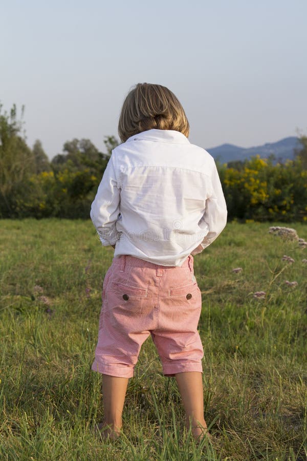 Boys and girls peeing outdoors