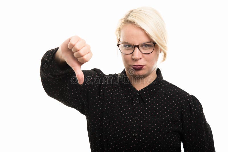 Young blonde female teacher wearing glasses showing thumb down g stock photography Young blonde female teacher wearing glasses showing thumb down g stock photography