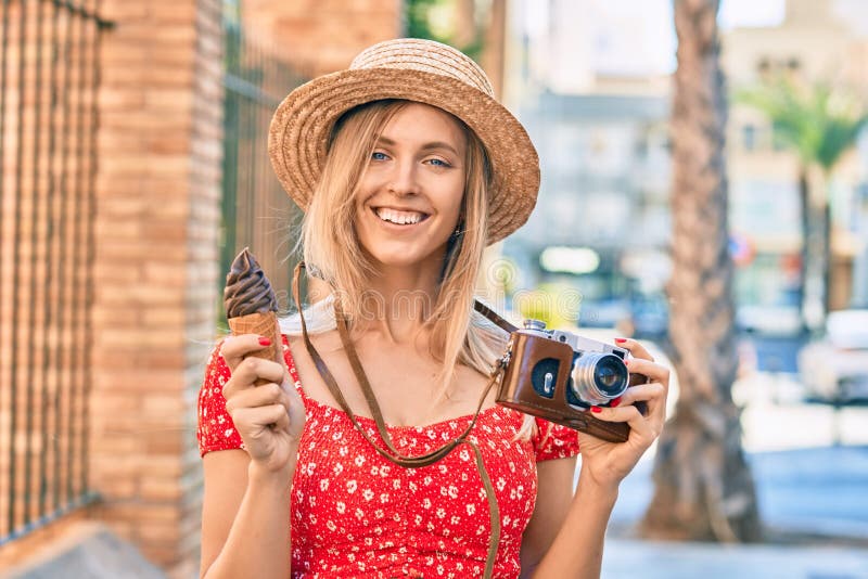 Young Blonde Tourist Woman Using Vintage Camera and Eating Ice Cream at ...