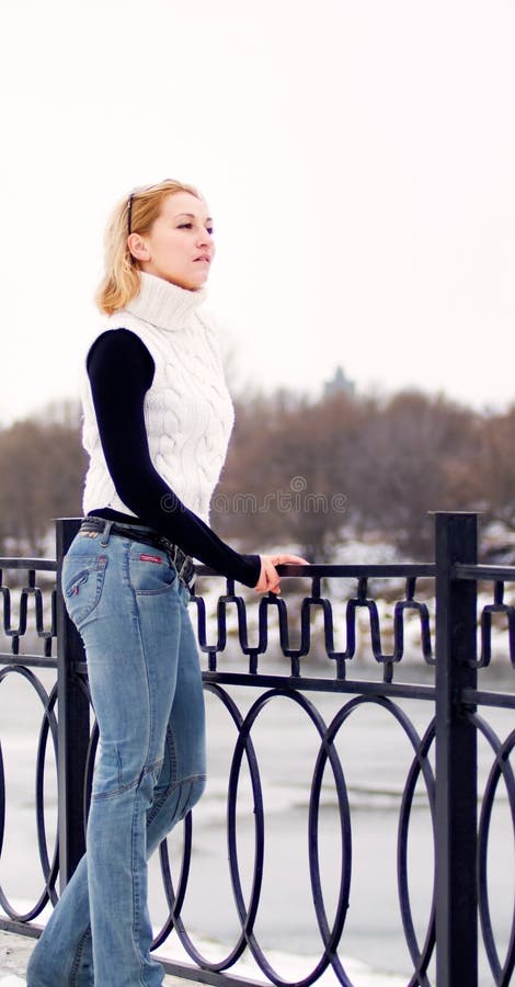 Young Blonde Woman Clothed In White Pullover Stock Image - Image of