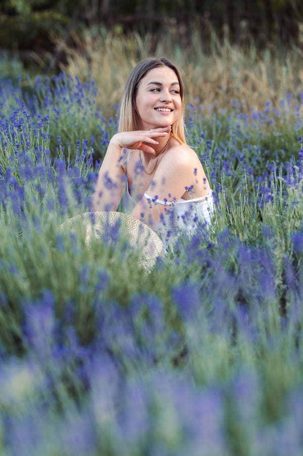 Young Blonde Woman in Lavender Meadow Smiling and Looking Away. Healing ...