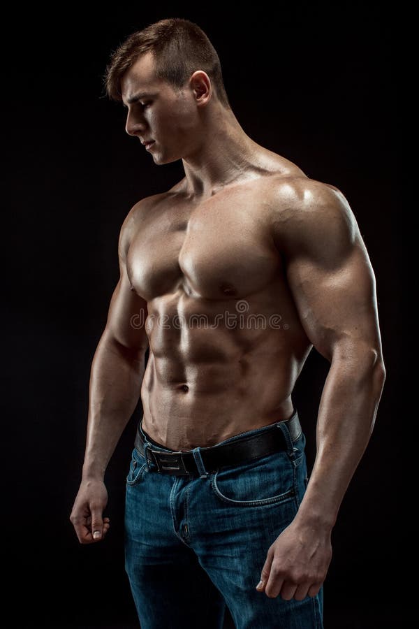 Young Bodybuilder On A Black Background Stock Image 