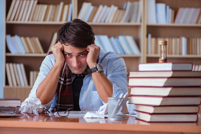 The young book writer writing in library royalty free stock images The young book writer writing in library royalty free stock images