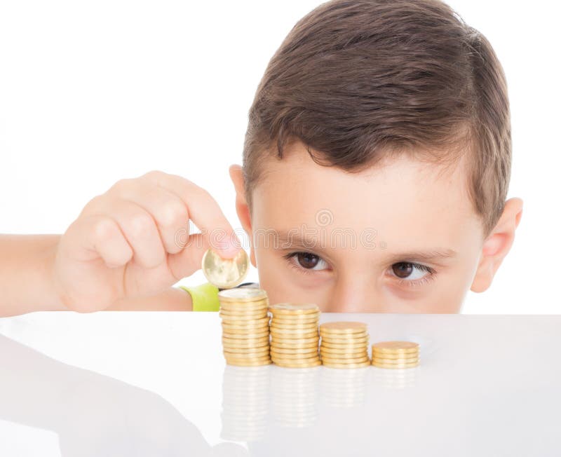 Young boy counting his coins stock images Young boy counting his coins stock images