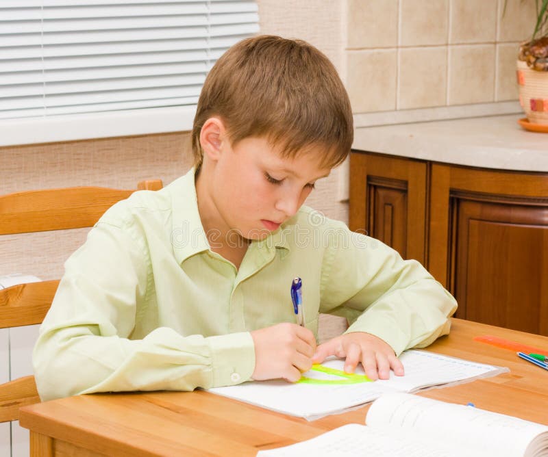 image of boy doing homework