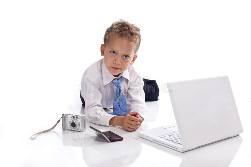 Young boy dressed as businessman with gadgets