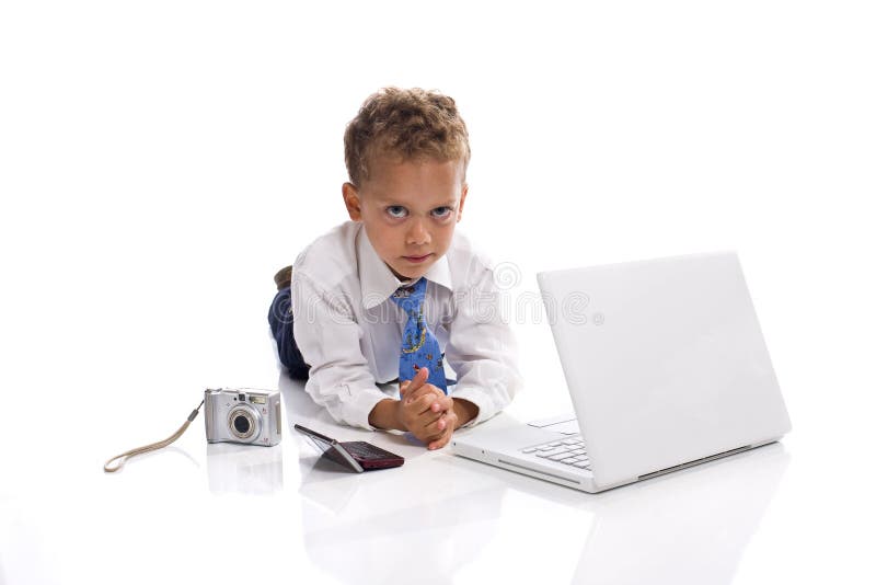 Young boy dressed as businessman with gadgets