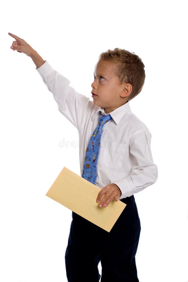 Young boy dressed as businessman holds envelope