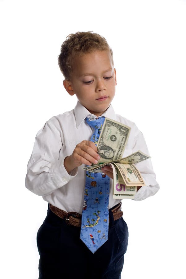 Young boy dressed as businessman holds money