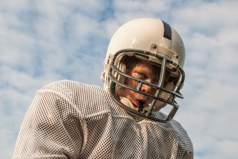 Young boy in football helmet stock photos Young boy in football helmet stock photos