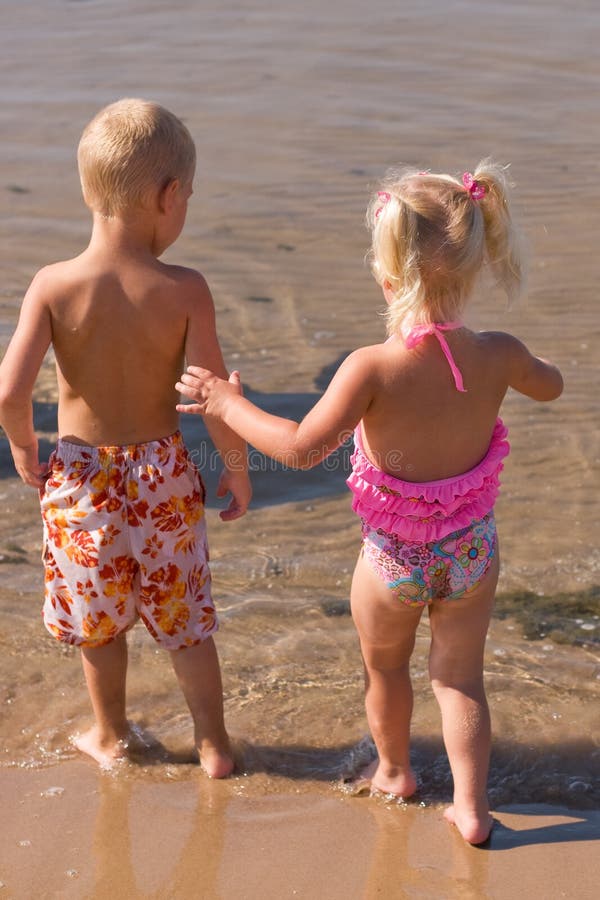 Young boy and girl at the beach