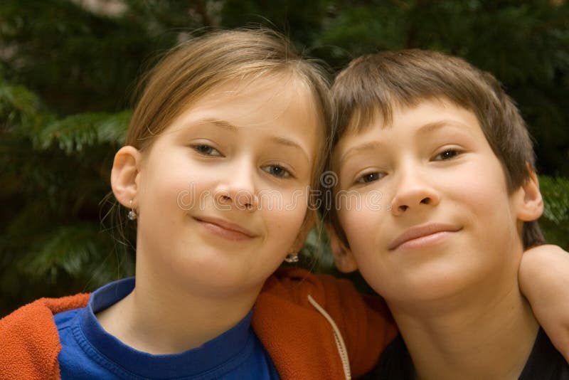 Young boy and girl hugging each other