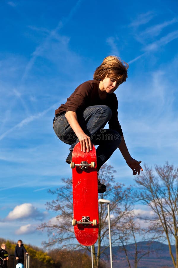 Young boy going airborne with his skateboard