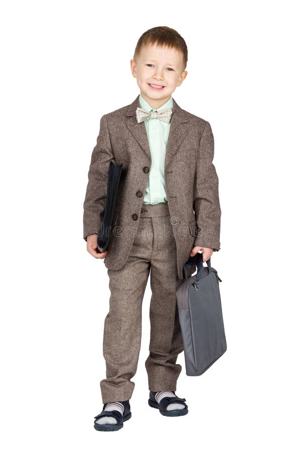 Young boy in grey suit and bow tie standing and looking on camera (isolated on white)