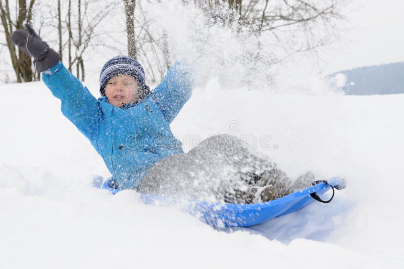 Young boy having fun on snow