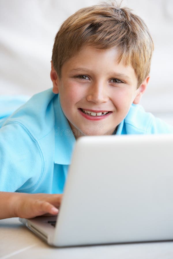 Young boy on his laptop computer at home. Laptop personal computer stock images, royalty-free photos and pictures