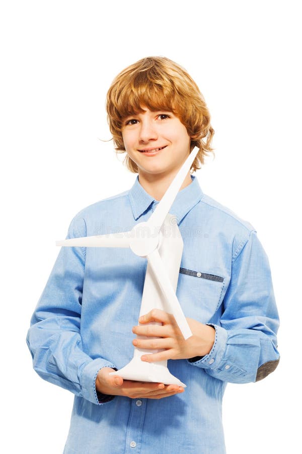 Young boy holding model of wind generator turbine stock image