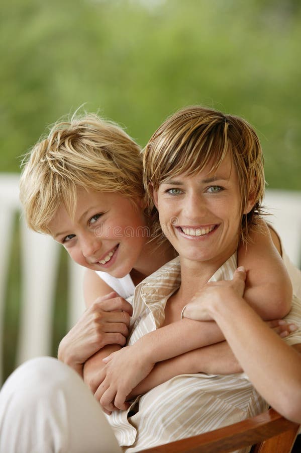 Young boy hugging his mother