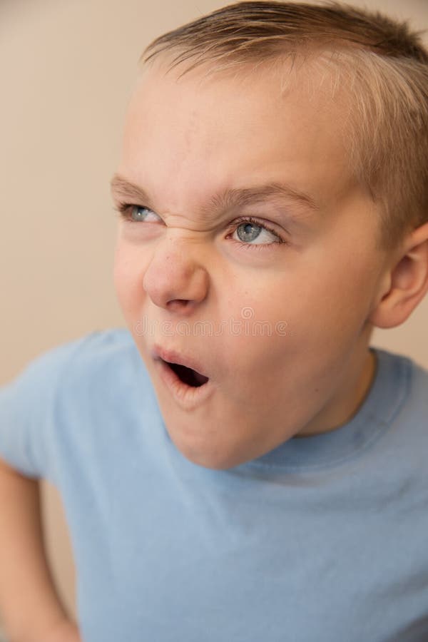 Young Boy Making a Funny Face while Playing Around Stock Image - Image of cute, emotion: 180296151 Young Boy Making a Funny Face while Playing Around Stock Image - Image of cute, emotion: 180296151