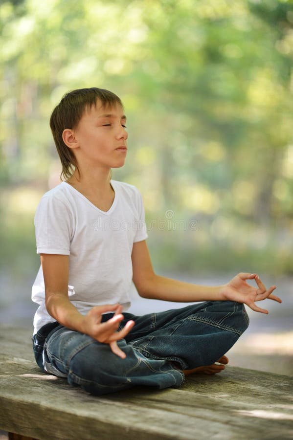Young boy meditation stock image. Image of cute, health 20762405