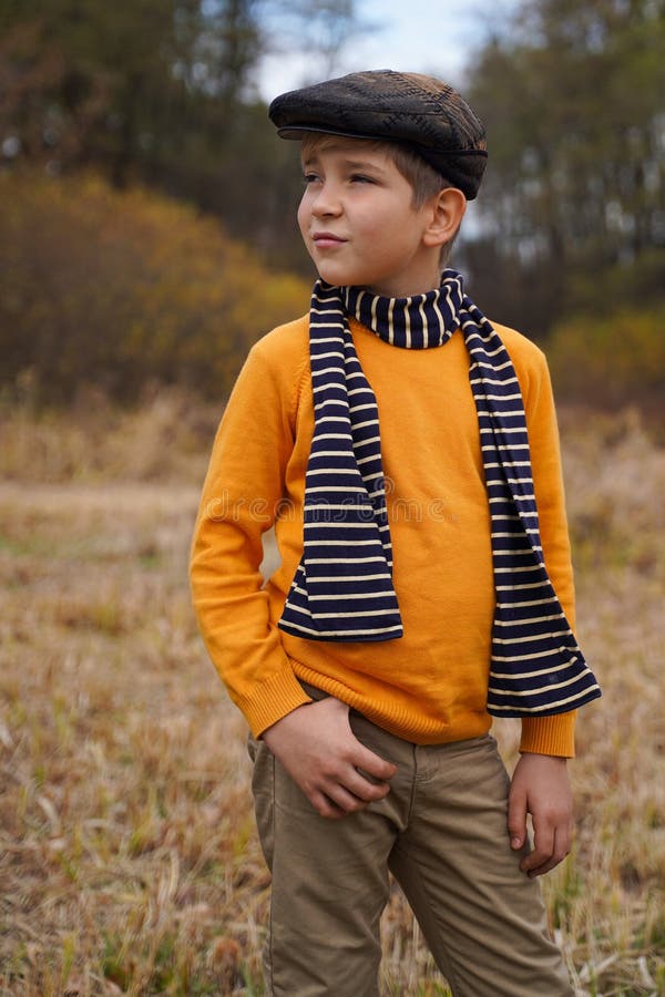 Young Boy Outdoor Standing with a Hand in His Pocket Stock Photo