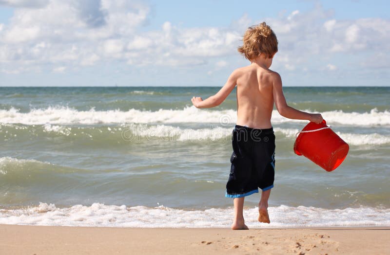 Young boy playing at the beach