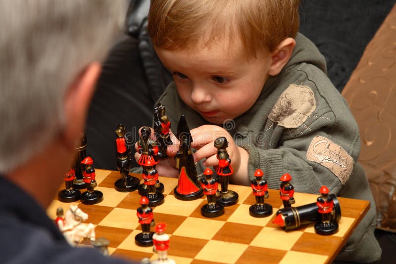 Young boy playing chess