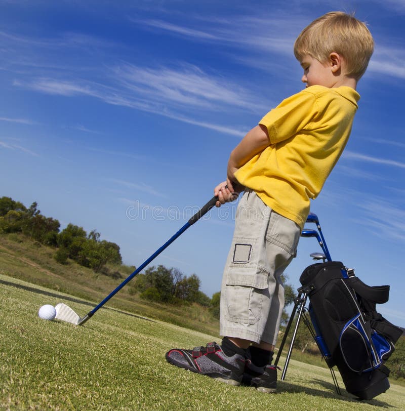 Young boy playing Golf stock photo. Image of handsome 18073762