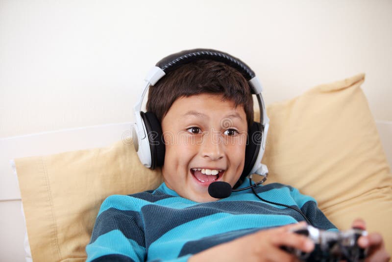 Boy playing a video game - Stock Image - T485/0068 - Science Photo